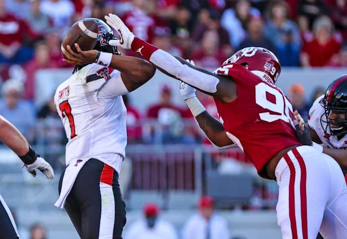 Oct 30, 2021; Norman, Oklahoma, USA; Oklahoma Sooners defensive lineman Isaiah Thomas (95) causes Texas Tech Red Raiders quarterback Donovan Smith (7) to fumble during the second half at Gaylord Family-Oklahoma Memorial Stadium. Mandatory Credit: Kevin Jairaj-USA TODAY Sports